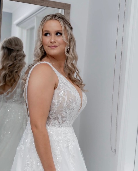 Bridal portrait of a bride in a white wedding gown, hair and makeup by De Ross Artistry