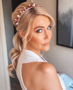 Special occasion hair and makeup with a pink floral headpiece by De Ross Artistry